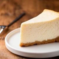 Ny Cheesecake · A slice of NY cheesecake made with a fresh crust filled with cream cheese.