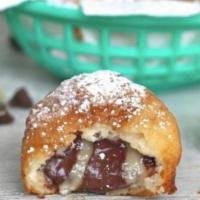 Cookie Dough · 4 chocolate chip cookie dough bites battered, topped with powdered sugar, and a side of choc...