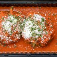 Stuffed Shells · Stuffed shells in our home-made marinara sauce and grated cheese.