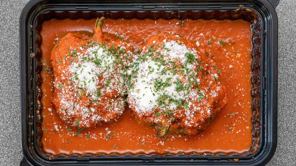 Stuffed Shells · Stuffed shells in our home-made marinara sauce and grated cheese.