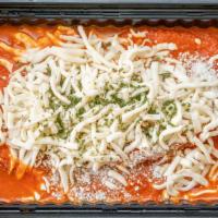 Chicken Cutlet Parmigiano · Chicken cutlet in homemade marinara sauce and topped with shredded mozz.