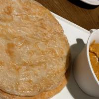 Indian Roti Prata Chicken Or Veg · butter bread served with appetizing rich yellow chicken or Veg. curry with string beans, car...