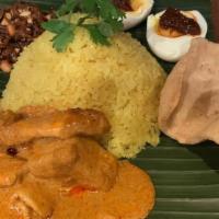Indonesia Turmeric Rice · rice with turmeric, chicken, egg, peanut, fried anchovies, sliced shrimp, potato, scallions,...