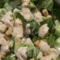 Caesar Salad · Romaine lettuce croutons grated cheese 2 oz dressing.