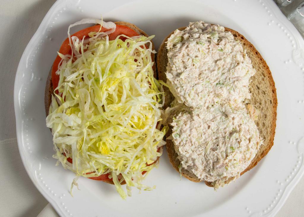 Tuna Salad (Full Tray) · On a bed of lettuce, cucumbers, red onions, and tomatoes with oil & vinegar.