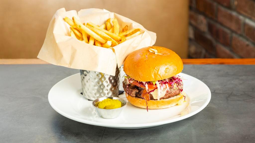 House Burger · Natural angus beef, applewood bacon, maple smoked cheddar, caramelized onions and served with french fries.