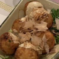 Takoyaki · Fried octopus balls topped with shavings of dried bonito and spicy mayonnaise.