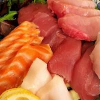 Sashimi · Assorted sashimi tuna, yellow tail, fluke, crabsticks, seasoned fish side rice.