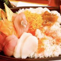 Chirashi Sushi · Assorted sushi topped on rice served in a large bowl.