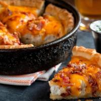 Pizza Skins · UNO’s signature deep dish pizza crust stuffed with mashed red bliss potatoes and topped with...