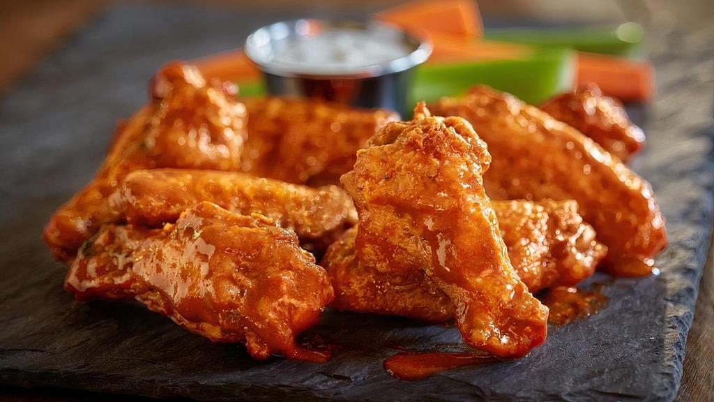 Chicken Wings  · Served plain or tossed in your choice of sauce:  Honey BBQ, Sweet Red Chili, or Spicy Buffalo.