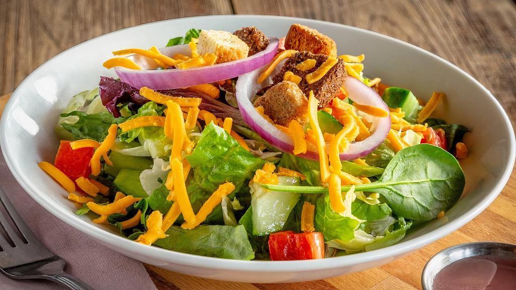 House Side Salad · Diced cucumbers and tomatoes, red onions, cheddar cheese, croutons.