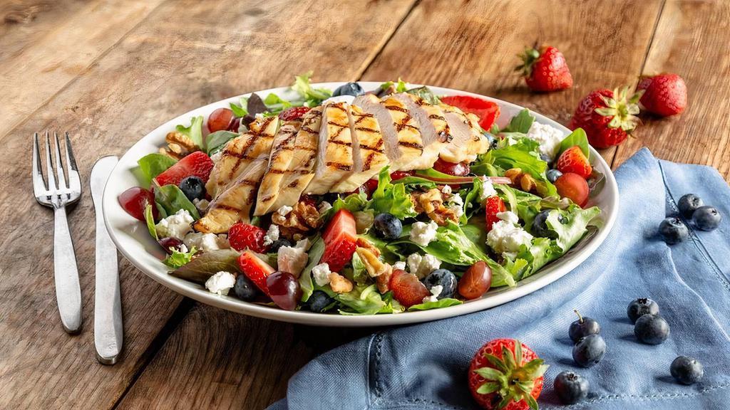 Berry & Goat Cheese Salad With Chicken · Spring mix with fresh strawberries, grapes, blueberries, and walnuts, tossed with low-fat honey vinaigrette, topped with goat cheese and a grilled chicken breast.