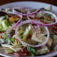 Italian Chopped Salad · A mixture of fresh greens, tomatoes, Kalamata olives, banana peppers and red onion rings tos...