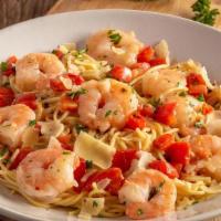 Shrimp Scampi · Shrimp sautéed with garlic, diced tomatoes, and basil in a
white wine sauce on thin spaghett...
