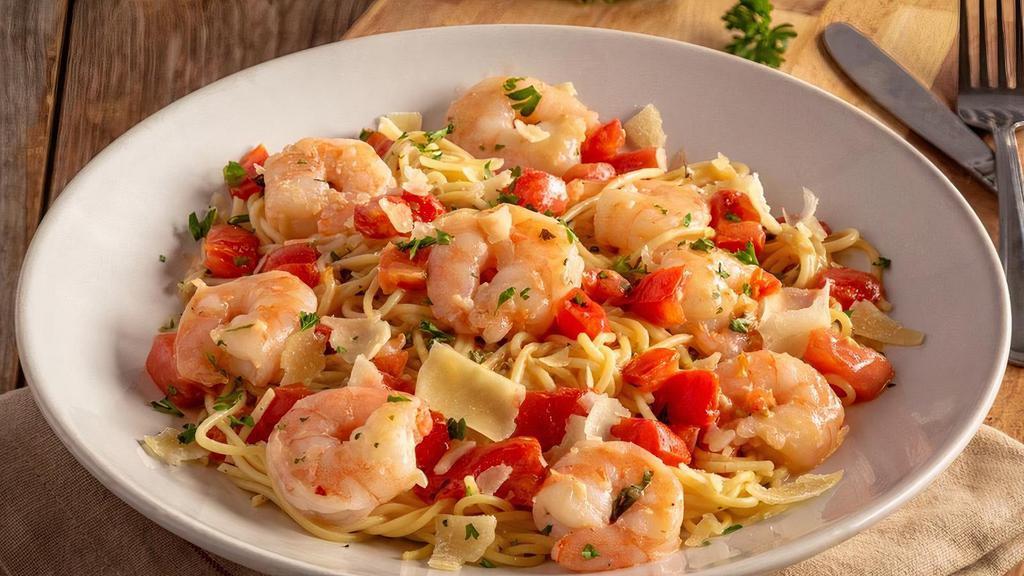 Shrimp Scampi · Shrimp sautéed with garlic, diced tomatoes, and basil in a
white wine sauce on thin spaghetti with parmesan.