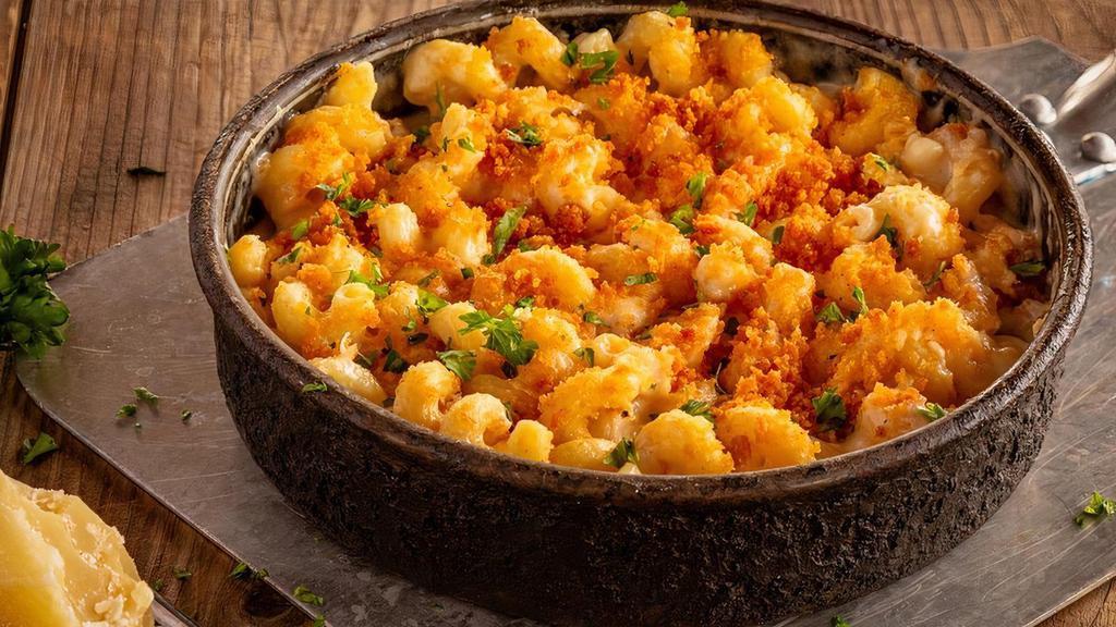 Mac & Cheese · Ooey, gooey, cheesy goodness – cavatappi with aged cheddar, asiago, and parmesan baked in a deep dish pan.