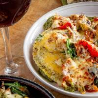Deep Dish Ravioli Veggie “Lasagna” · Uno’s twist on a classic favorite. Three jumbo raviolis filled with creamy ricotta, topped w...