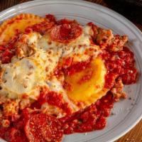 Deep Dish Ravioli Meat “Lasagna” · Uno’s twist on a classic favorite. Three jumbo raviolis filled with creamy ricotta, topped w...