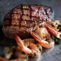 Grilled Shrimp & Sirloin · A 10oz. USDA choice top sirloin and a skewer of shrimp basted in a basil and garlic marinade.