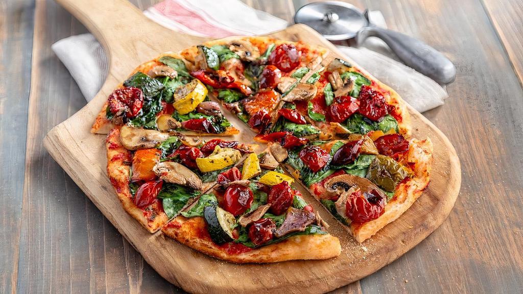 Vegan Garden Pizza · Fresh spinach, roasted vegetables, mushrooms, seasoned cherry tomatoes, and pizza sauce on our thin crust dough.