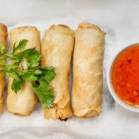 Spring Rolls · Fried veggie rolls served with sweet chili sauce.