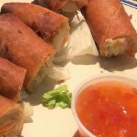 Spring Rolls · Vegetable spring rolls served with sweet and spicy chili sauce.