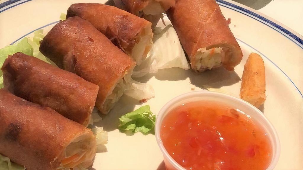 Spring Rolls · Vegetable spring rolls served with sweet and spicy chili sauce.