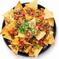 Nachos · Nacho chips topped with melted cheese, beef, refried black beans, and charred chipotle salsa.