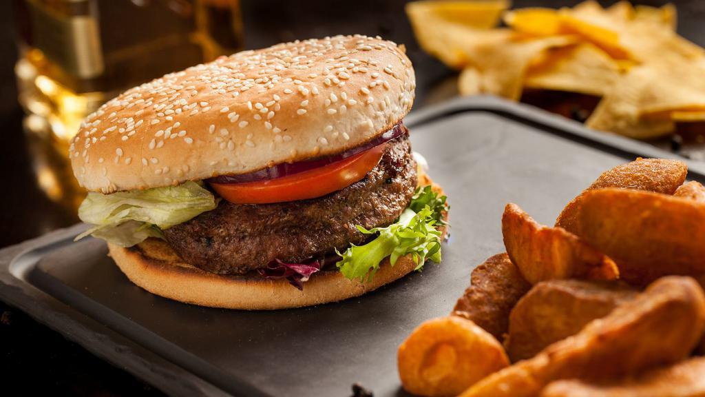 Hamburger · Mouthwatering Grilled Beef Burger in a bun.