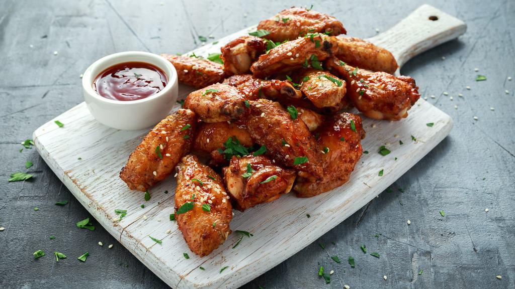The Bbq Wings · Chicken wings fried to golden perfection, topped with BBQ sauce.