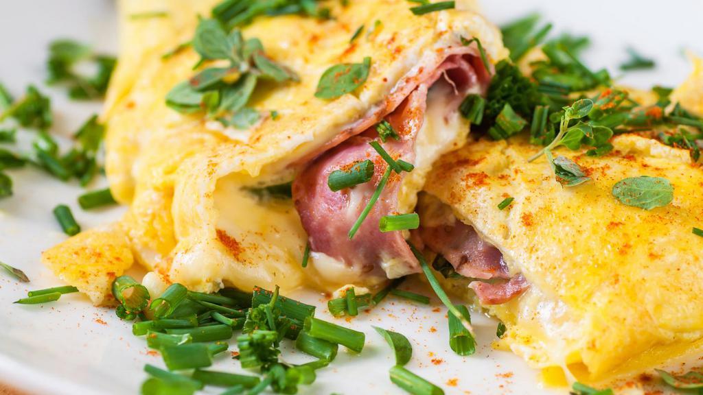 Ham Omelette · Delicious Ham Omelette made with three eggs and ham, prepared to customer's preference. Served with a side of buttered toast and jelly.