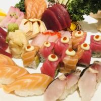 Sushi And Sashimi · Five pieces sushi, twelve pieces sashimi, and one california roll.