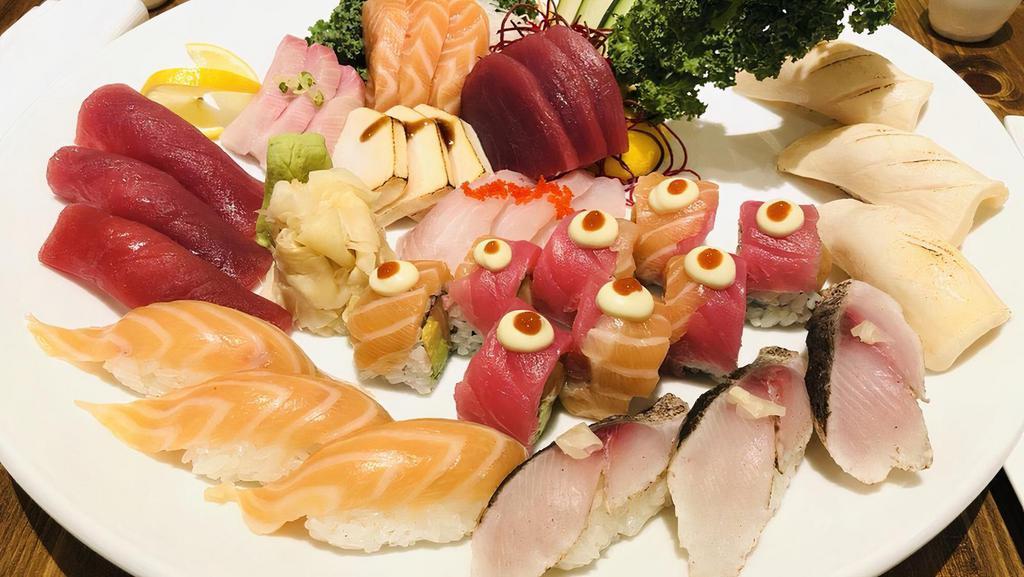 Sushi And Sashimi · Five pieces sushi, twelve pieces sashimi, and one california roll.