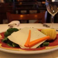 *Carpaccio Con Arugula · Raw filet mignon sliced very thin with arugula and Parmigiano cheese.
 * Consuming raw or un...