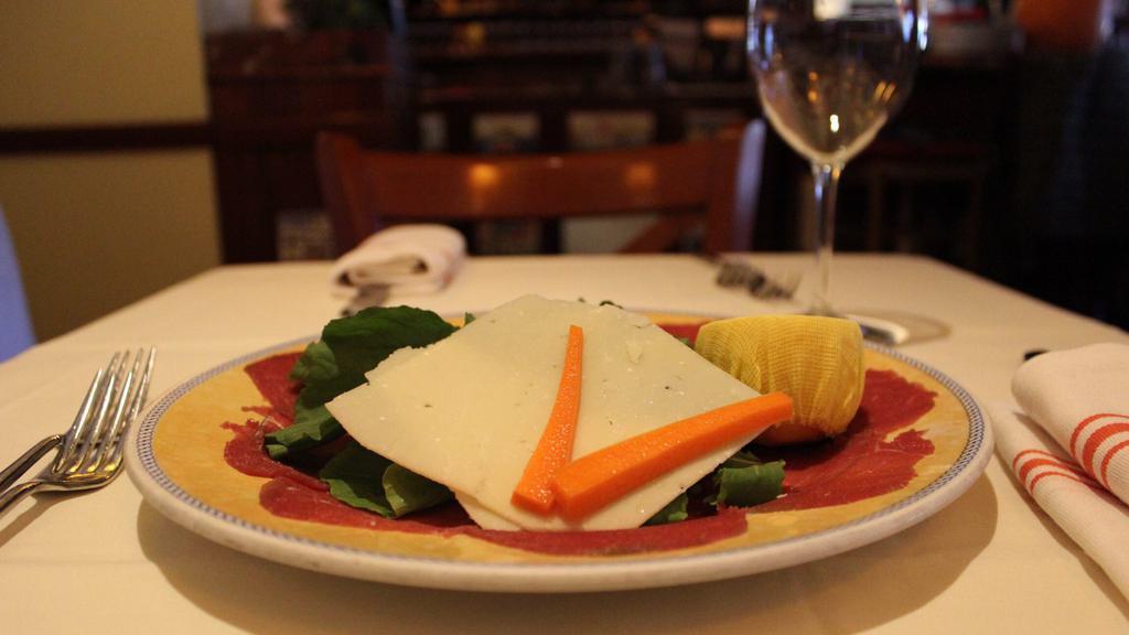*Carpaccio Con Arugula · Raw filet mignon sliced very thin with arugula and Parmigiano cheese.
 * Consuming raw or undercooked meat, poultry, seafood, shellfish, or eggs may increase your risk of food borne illness *.