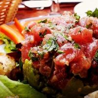 *Tartare Di Tonno Fresco · Fresh sashimi grade tuna tartare served on guacamole. * Consuming raw or undercooked meat, p...