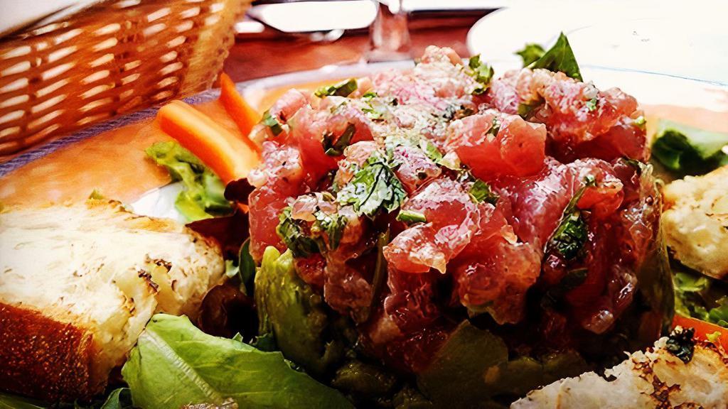 *Tartare Di Tonno Fresco · Fresh sashimi grade tuna tartare served on guacamole. * Consuming raw or undercooked meat, poultry, seafood, shellfish, or eggs may increase your risk of food borne illness *.