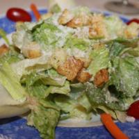 Caesar Salad · Garlic croutons on top of this classic are wonderful, as is the anchovy-infused creamy dress...