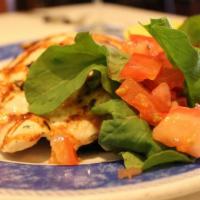 Petto Di Pollo Paillard · Grilled brest of chicken paillard, served with spinach and carrot.