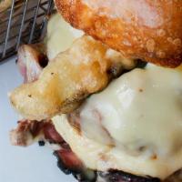 Pb Cuban · Pastrami, pulled pork, fried pickles, swiss cheese and dijon mustard spread on a pretzel bun.