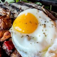Steak ‘N Eggs · NY strip, home fried potatoes, sautéed onions, arugula, and two eggs your way. topped w/chim...