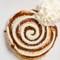 Cinnamon Bun Pancakes · Cinnamon-brown sugar swirled buttermilk pancakes topped with a sweet cream cheese frosting a...