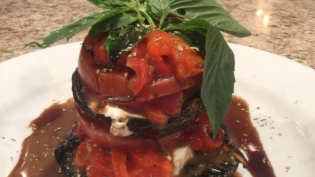 Grilled Portobello Tower · Layered with fresh mozzarella, roasted peppers, tomato and basil drizzled with balsamic vinaigrette.