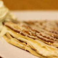 Cinnamon Roll Crepe · Homemade sweet cream melted in a cinnamon swirled crepe topped with icing.