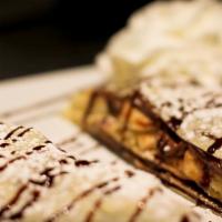 Dirty Banana Crepe · Regular. Nutella and sliced banana. Sweet crepes are not served with syrup or whipped cream ...
