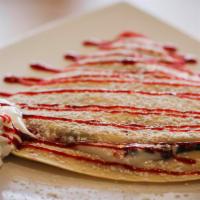 Raspberry Cheesecake Crepe · Homemade sweet cream cheese, chocolate chips, raspberry topping.