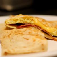 Basic Breakfast Crepe · Regular. Scrambled eggs and your choice of cheese. Add ham or bacon.