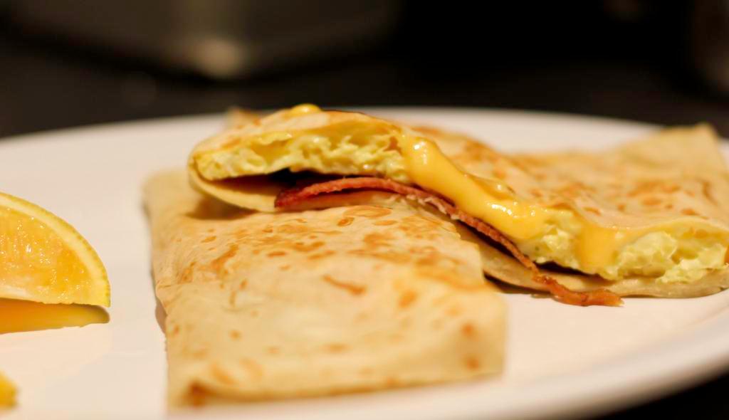 Basic Breakfast Crepe · Regular. Scrambled eggs and your choice of cheese. Add ham or bacon.