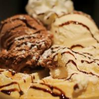 Waffle Sundae · Waffle with chocolate or vanilla ice cream topped with chocolate syrup.